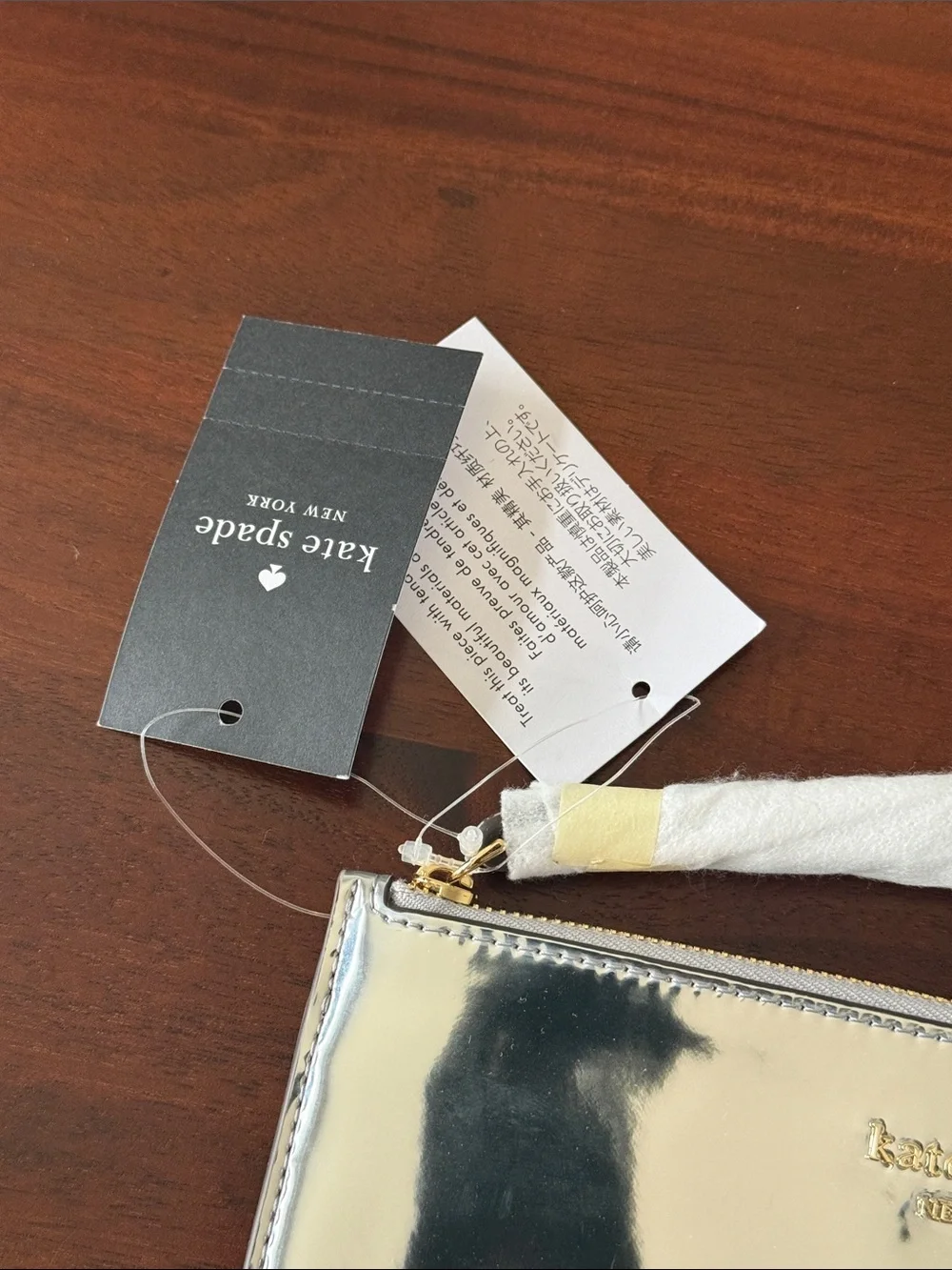 kate spade New York Lucy Metallic Silver L Zip-Around Wristlet new